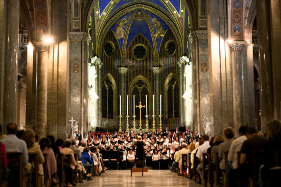 Choir singing in a church during their performance tour