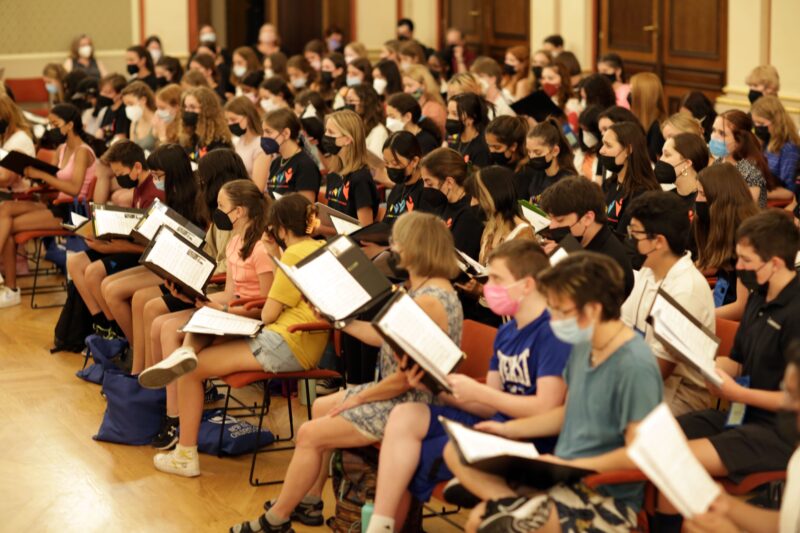Choir students rehearsing for a performance at the 2022 Prague Choir Festival.
