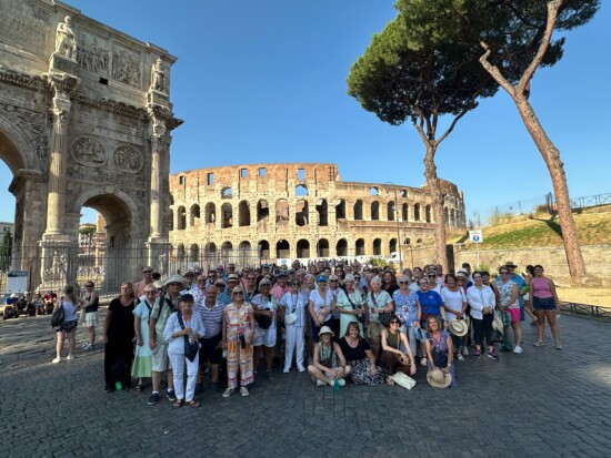The Outer Banks Chorus enjoying their performance tour of Italy, posing at the Colosseum in Rome. Performance travel
